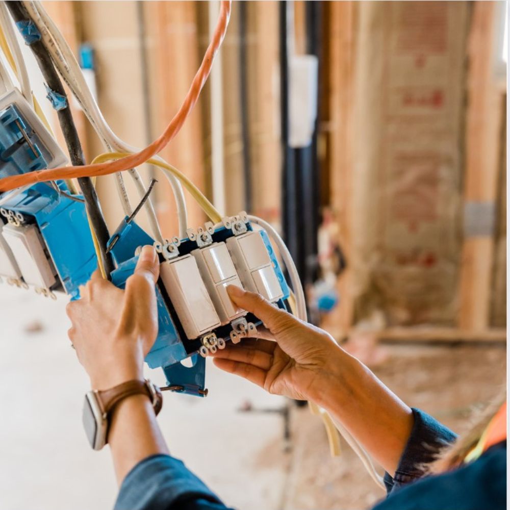 Skilled electrician from South Shore Electric safely installing electrical wiring in a Granite Bay home