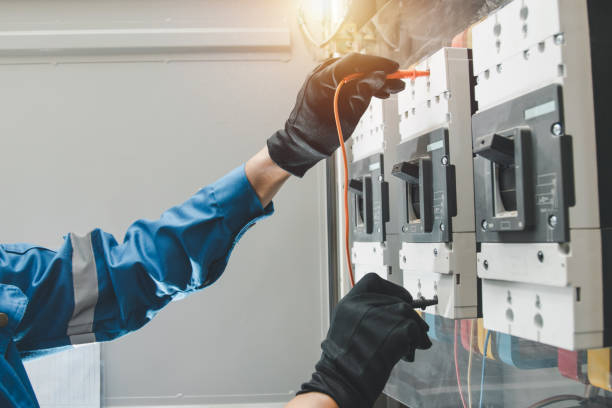 Technician performing Electrical Troubleshooting in a Tahoma, CA cabin while testing a wall outlet