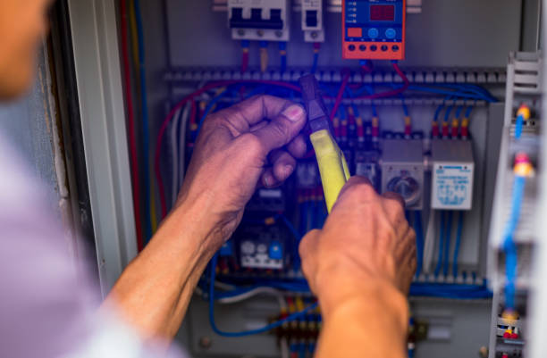 Electrical Troubleshooting in Tahoma, CA as an electrician tests wiring at a home service panel