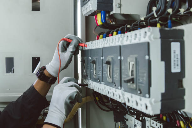 Electrical Troubleshooting in Truckee, CA as an electrician tests a breaker panel in a mountain home