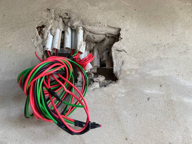 Technician performing Home Rewiring in a Kings Beach, CA house while tracing and replacing aging electrical cable