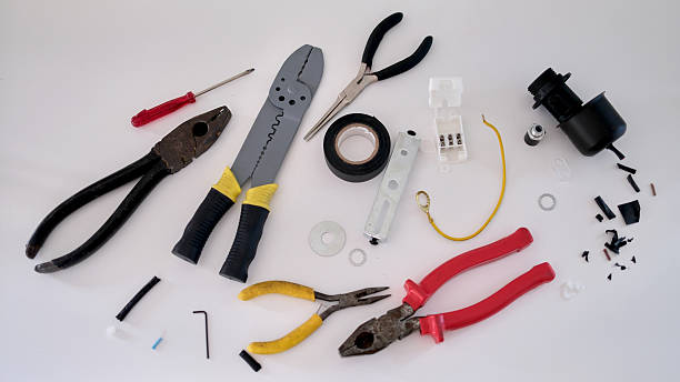 Electrician performing Home Rewiring inside a Granite Bay, CA residence while tracing circuits and replacing outdated cable